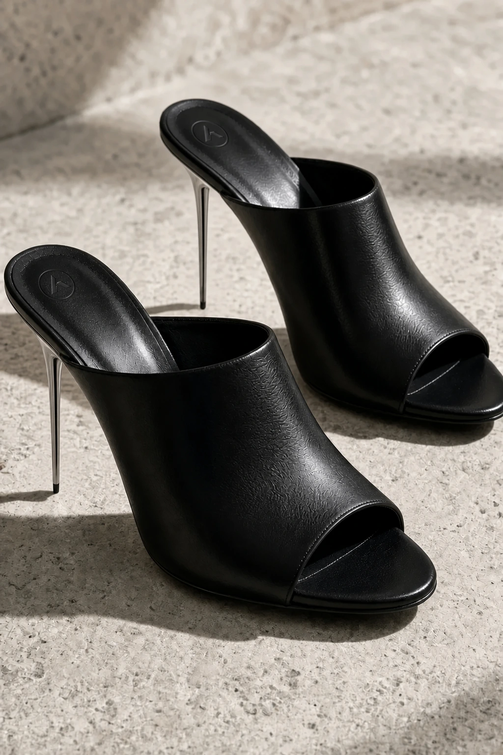 Spire — Open-toe mule, polished chrome needle heel